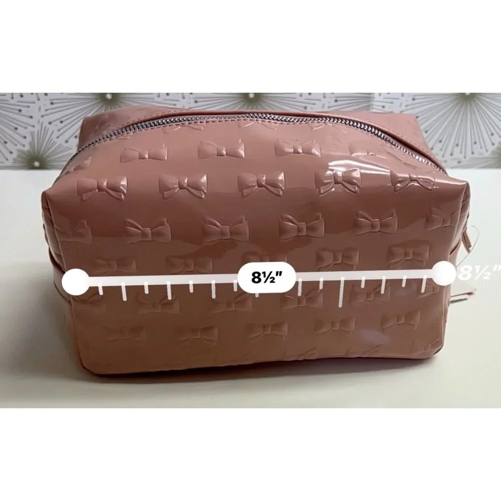 Betsey Johnson embossed patent travel/cosmetic bag in blush pink. NWT.